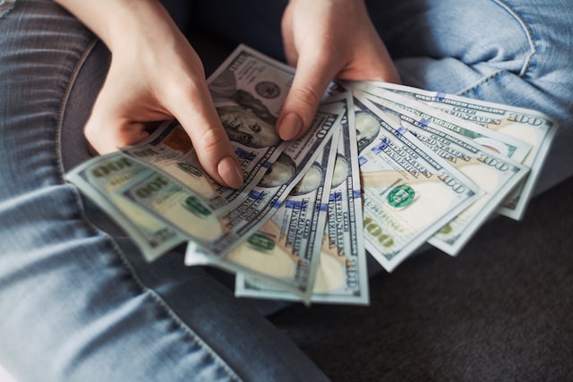 person holding banknotes