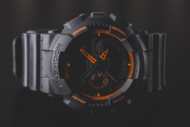 round black and orange Casio G-Shock analog watch
