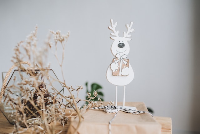 white reindeer on tree branch