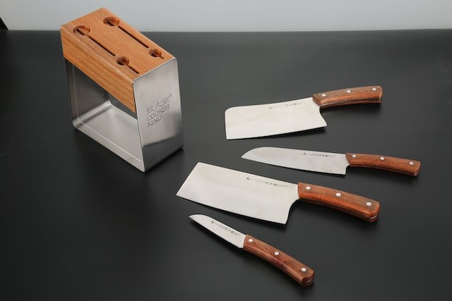 Brown wooden handled knife on white chopping board