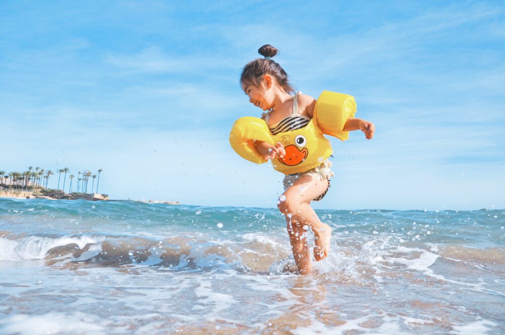 a child swimming in a sea