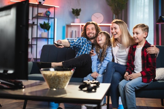 family on the couch watching TV