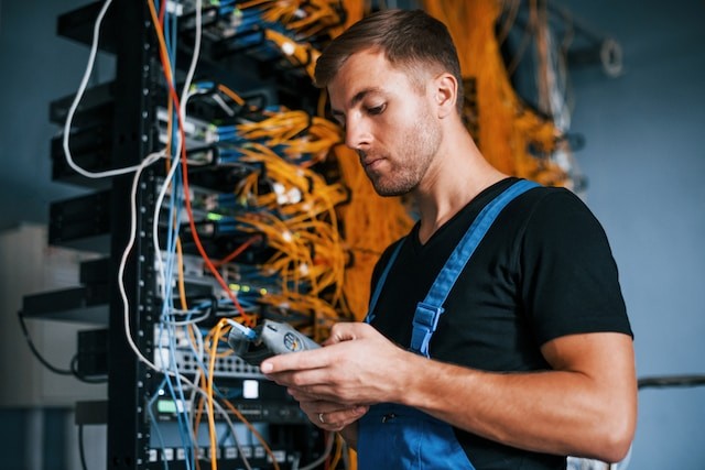 young man in uniform have a job with internet equipment