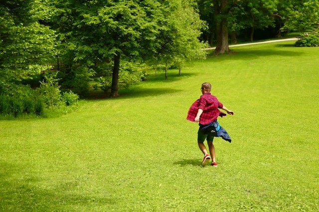 person running on grass