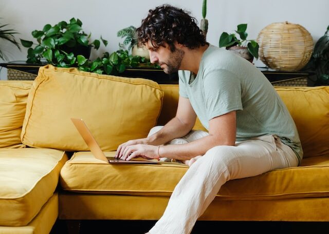 man on l shaped sofa