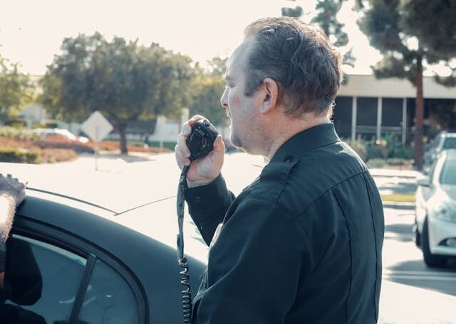 a-police-officer-using-a-communication-radio